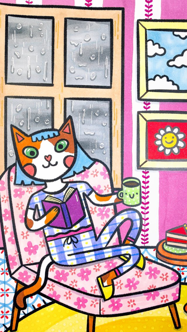 Gata leyendo un libro con una taza, en un sillón floreado mientras llueve afuera